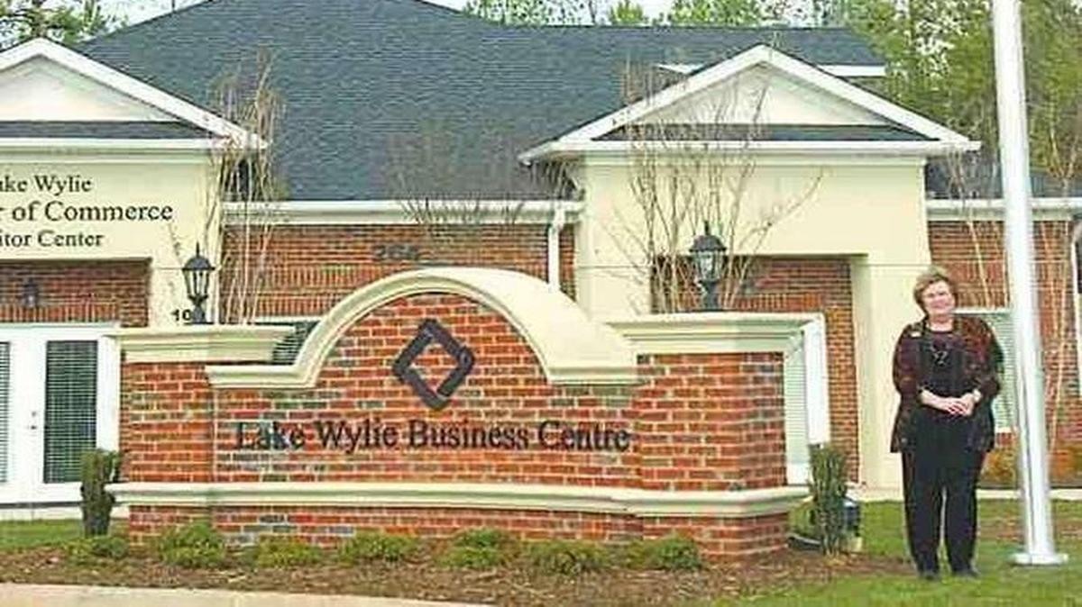 
Lake Wylie Chamber of Commerce president Susan Bromfield stands in front of the chamber office and visitor center during the 2008 opening.
