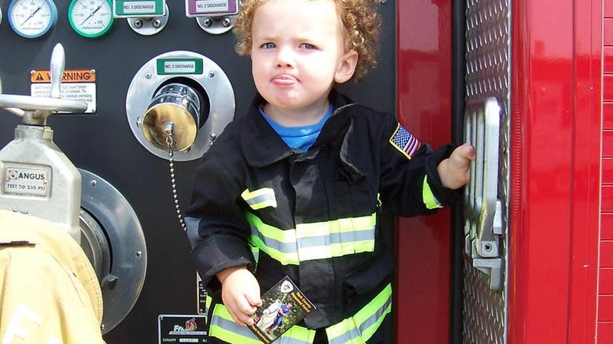 
Nash Adams, 1, of Steele Creek enjoyed the firetrucks at the Aug. 15 Community Day, hosted by Lake Wylie Bowl N’ Bounce. He didn’t know how to smile, so his dad had him stick out his tongue.
