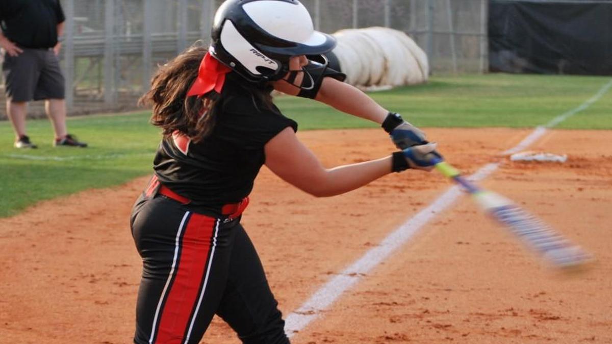 Nation Ford’s Sabrina Johnson takes a pitch to opposite field against Chester.
