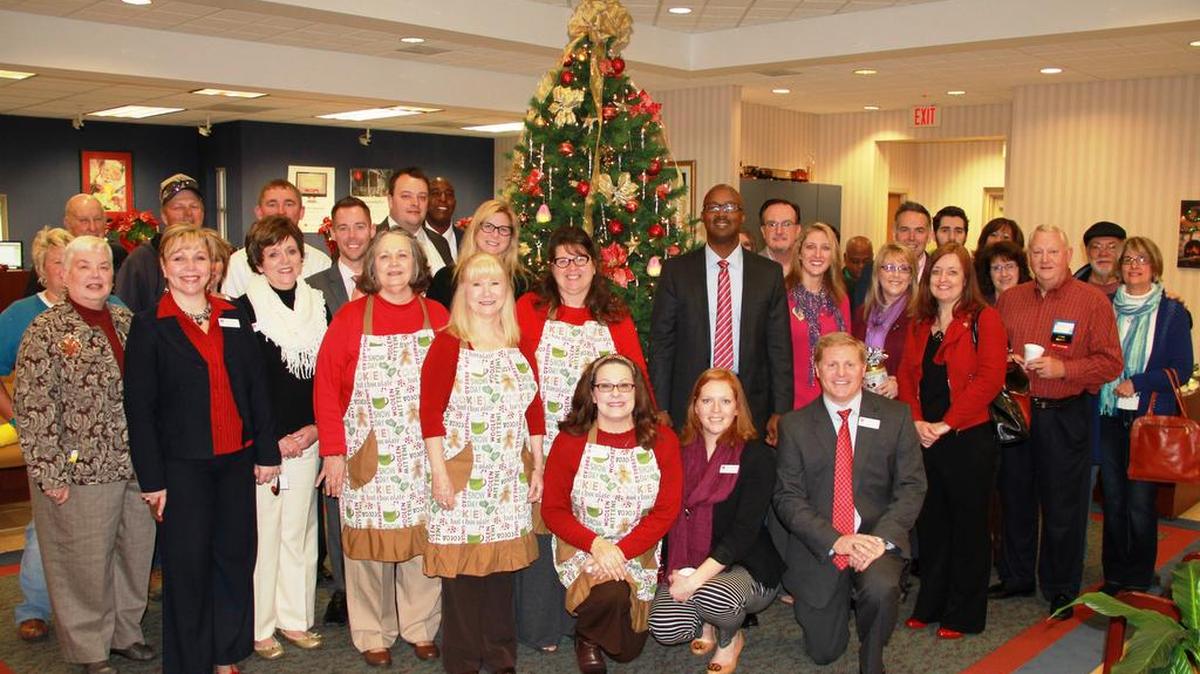 CommunityOne Bank in Stanley treated customers, Montcross Area Chamber members and guests to a holiday kickoff breakfast Dec. 3. Kneeling from left are branch leader Diana Blair, Hillary Kestler and Robert Reese.
