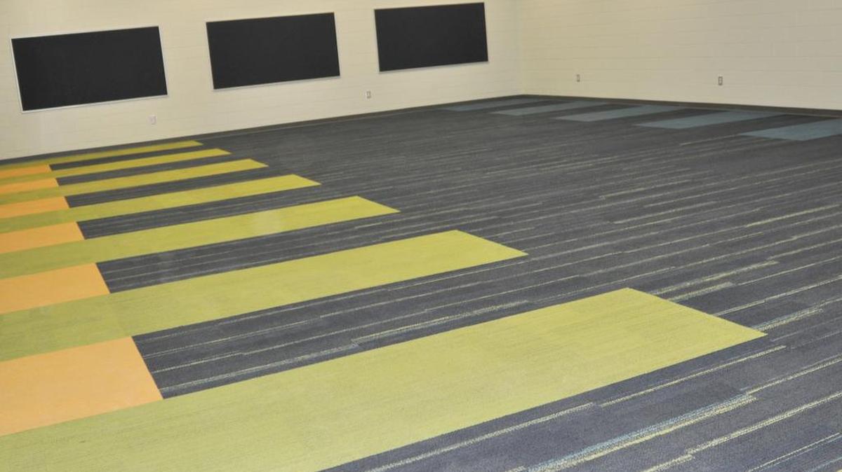 The band room at the new Clover Middle School includes carpet to “resemble piano keys.”