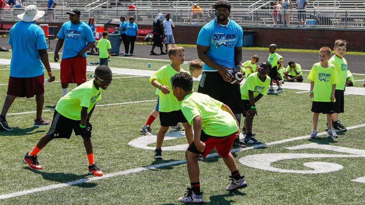 Kimathi “Kee” Lightner gets ready to snap the ball on Saturday as Nation Ford High School hosts the Ko Simpson Stars of Tomorrow Football Camp.