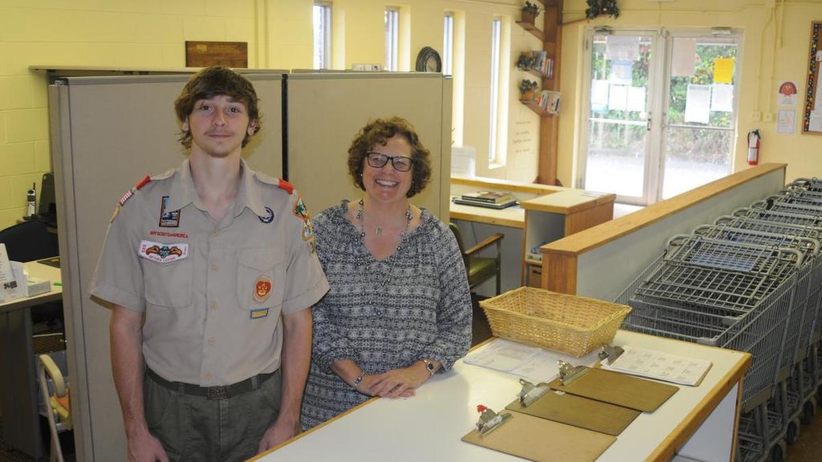 Greyson Floyd, with Clover Area Assistance Center director Karen van Vierssen, spruced up the entrance and other areas at Clover Area Assistance Center as part of his Eagle Scout project.