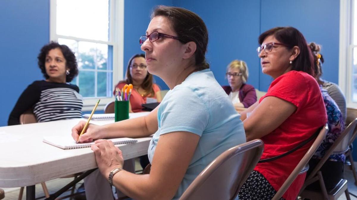 Soula Petropoulou takes notes during a English as a second language class at Flint Hill Baptist Church in Fort Mill.