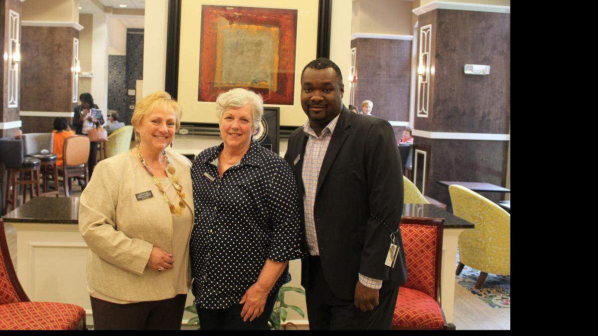 
Hampton Inn Charlotte-Belmont General Manager Carolyn Barnes, center, with sales coordinator Korey Small and Montcross Area Chamber Board of Directors Chairwoman Melia Lyerly of Lyerly Agency during the April 9 network after work event showcasing the hotel renovations.
