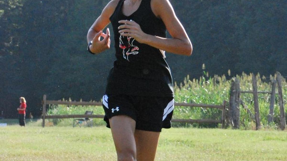 Nation Ford’s Katie Pou crosses the finish line while winning the girls’ race in the Falcons’ meet with Rock Hill. She was the school’s only first-place winner.