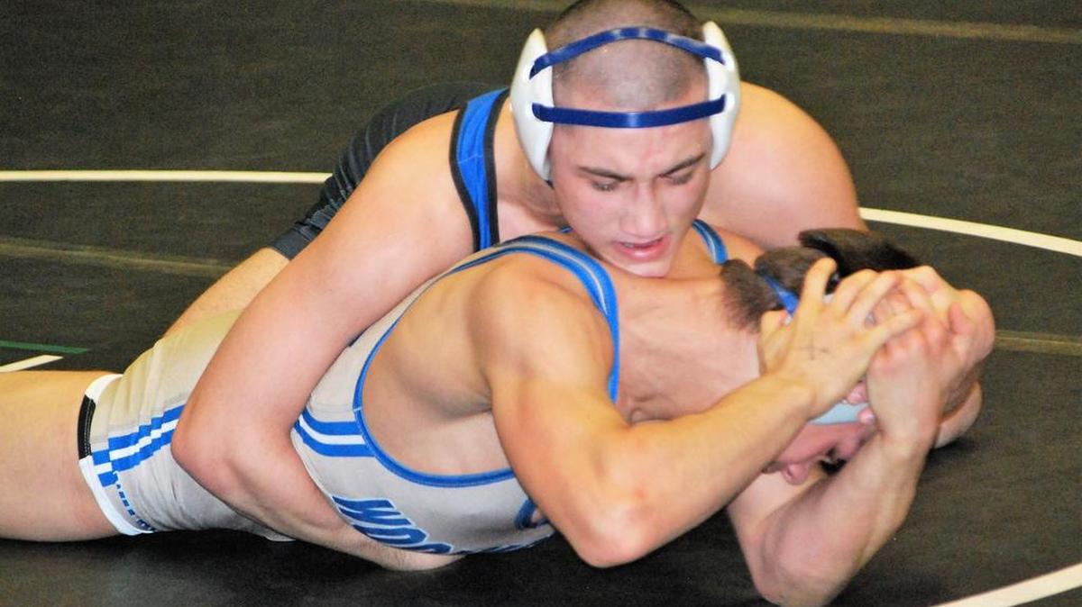 Jake Hart (top) shown wrestling for Fort Mill High in the Upper State tournament, was a runner-up in the high school nationals this past weekend.