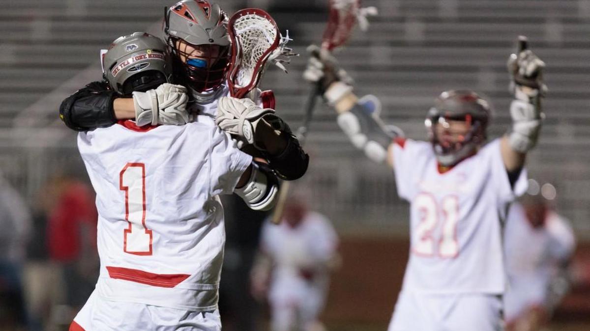 Jack McCullough (1) of Nation Ford celebrates the winning goal as the Falcons defeated Fort Mill for the first time. NaFo won 11-10 in overtime.