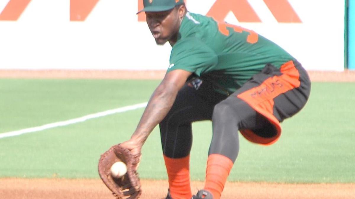 Kevin Woods, now with the Chicago White Sox’ minor league club in Kannapolis, N.C., backhands a ball at first base during infield practice while with a Marlins affiliate last season.