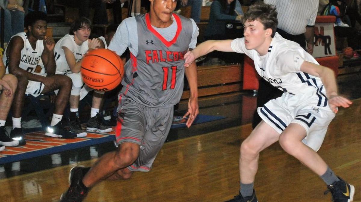 Nation Ford’s Shaman Alston drives to the basket during the Border Battle at Marvin Ridge.