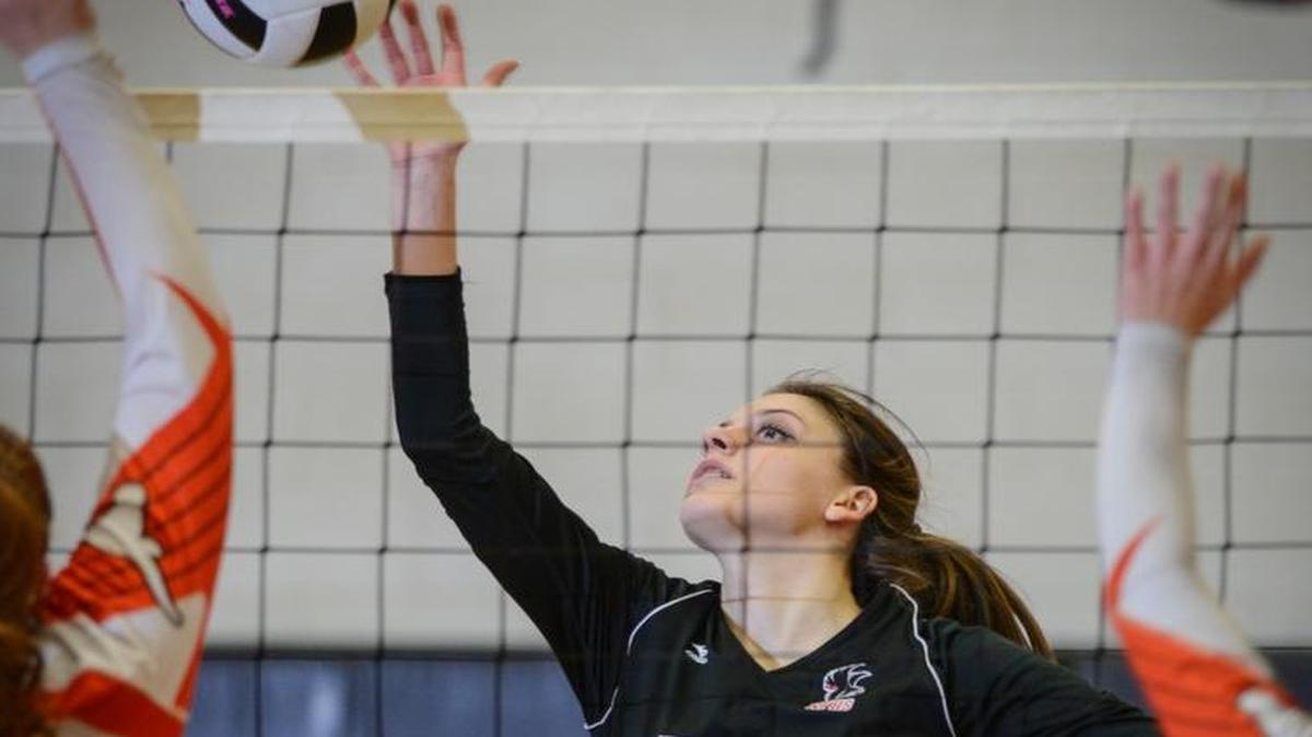 NaFo junior Quin Sutphin (10) taps the ball back over the net during Tuesday's playoff match win over Mauldin at NaFo.