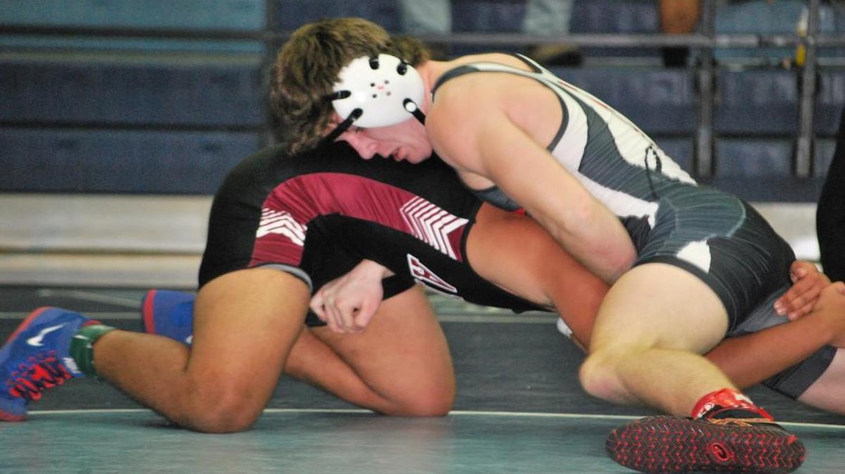 Nation Ford’s Dylan Curtsinger, left, earns one of his four wins in the Seahawk Slam at Hilton Head High.