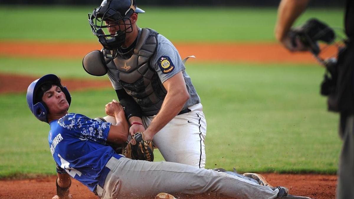 Fort Mill's Kobie MacKinnon (4) beats the tag at home to tie the game against York.