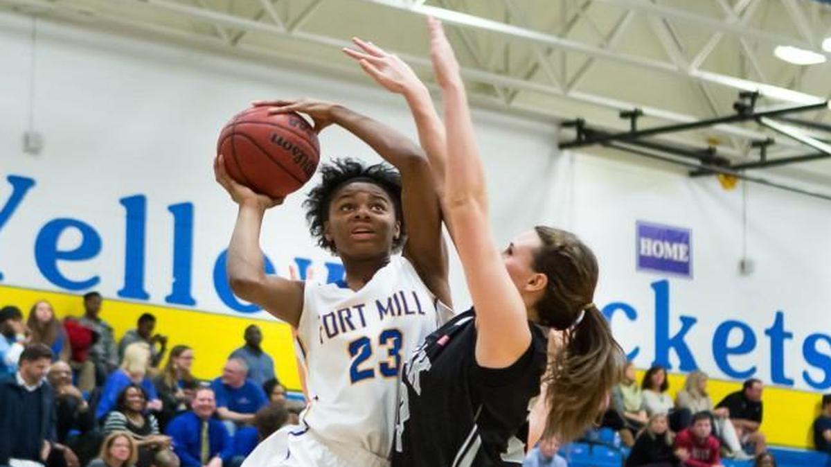 Fort Mill's Amiah Lindsay (23) battles for the shot as Fort Mill defeated York for its third region win.