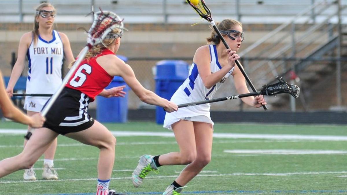 Fort Mill's Sawyer Wilcox scores Thursday night against Nation Ford.