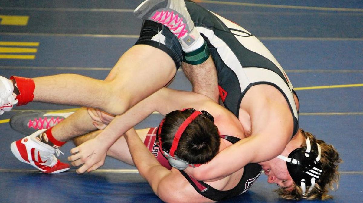 Jacob Moore of Nation Ford attempts to pin an opponent during the Region IV tournament. Moore finished fourth at 145 pounds.