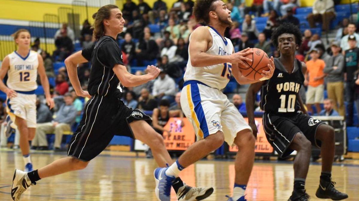 Fort Mill's Rob McIntyre takes a shot Friday night against York. The Cougars defeated the Yellow Jackets 68-63.