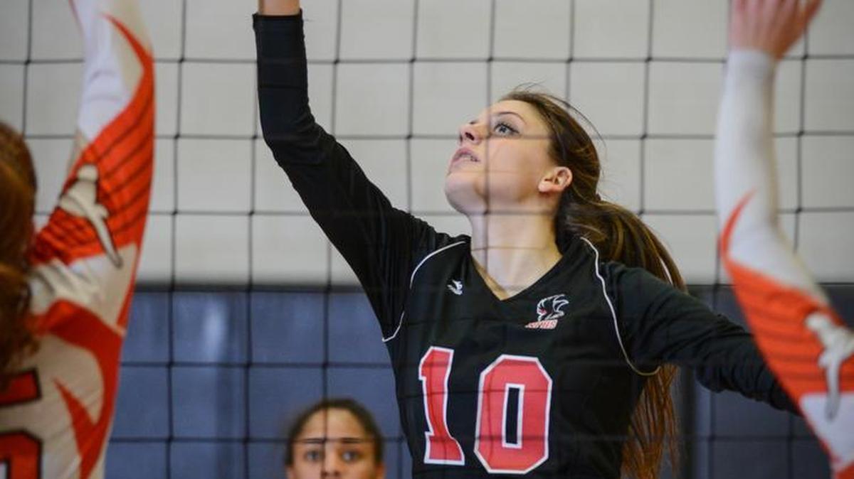 NaFo junior Quin Sutphin (10) taps the ball back over the net during Tuesday's playoff match win over Mauldin at NaFo.