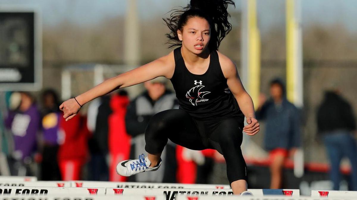 Tessa Kramer clears a hurdle as Nation Ford defeated Northwestern in a Wednesday evening track meet.