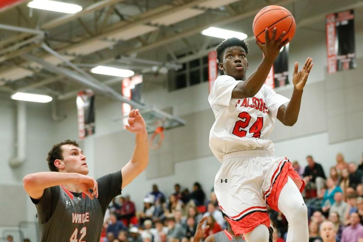 Nation Ford’s Malik Bryant (24) glides to the basket as Nation Ford mounted a furious fourth-quarter rally in a playoff loss to Wade Hampton in February 2018.