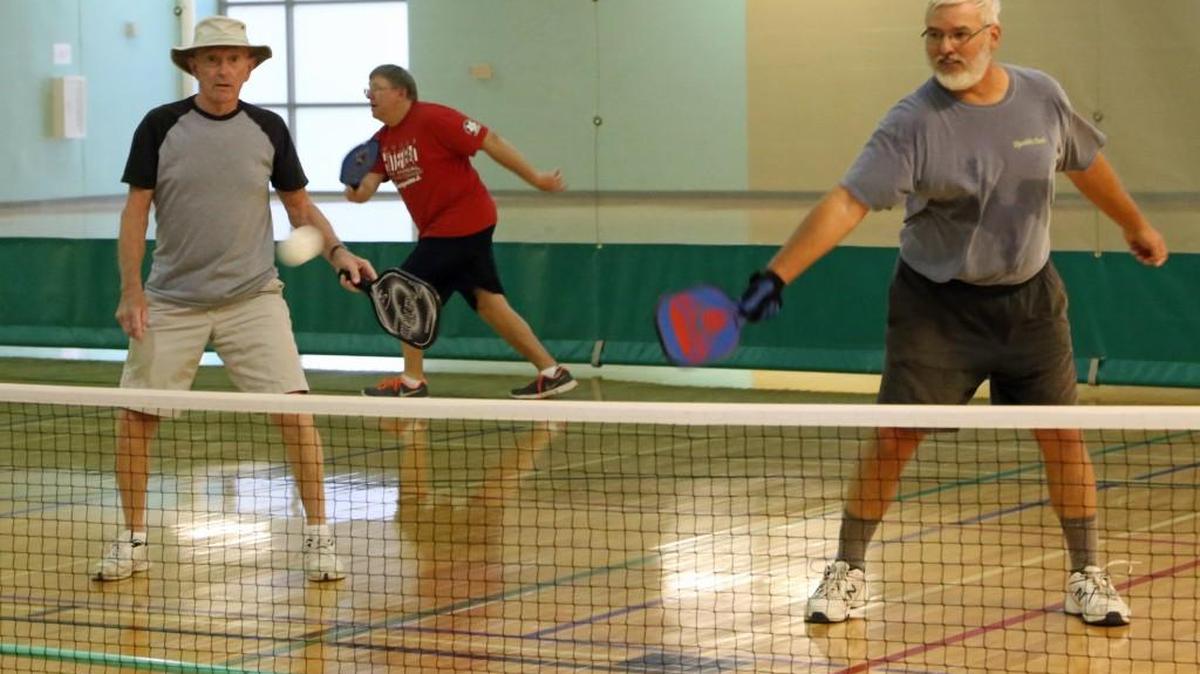 John Finn, left of Peculiar and Jim Koeneman of Lee's Summit play Pickleball at Legacy Park Community Center.