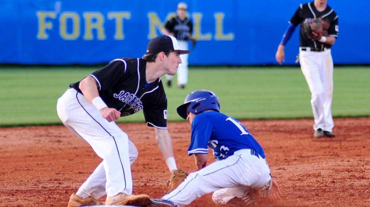 Fort Mill senior Bartow Keller tags out Woodmont senior Sam Drummond at third Friday night.