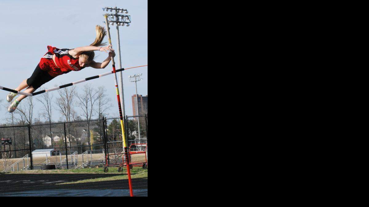 
Nation Ford’s Megan Gallagher tries clearing the rope during the pole vault.
