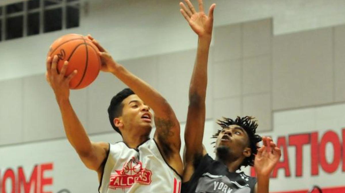 Nation Ford's Eric Moulds takes a shot during a scrimmage against York. The prep basketball schedule gets underway this week.