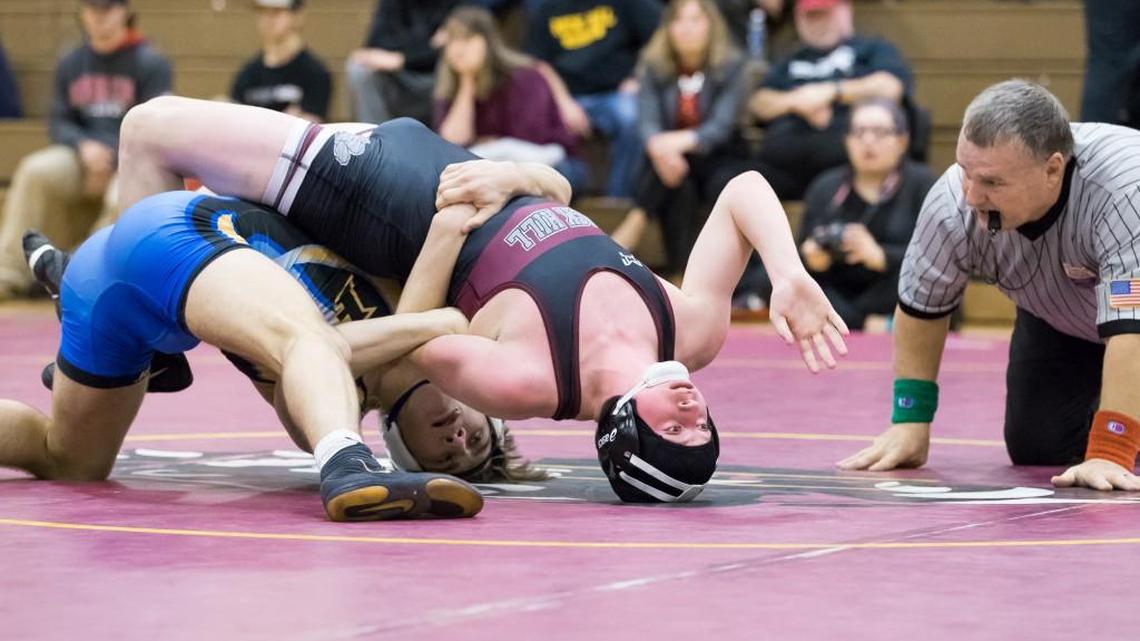 Fort Mill's Jake Hart wrestles Rock Hill's Alex English in the 160-pound weight class as Rock Hill hosted Fort Mill in varsity wrestling Thursday.