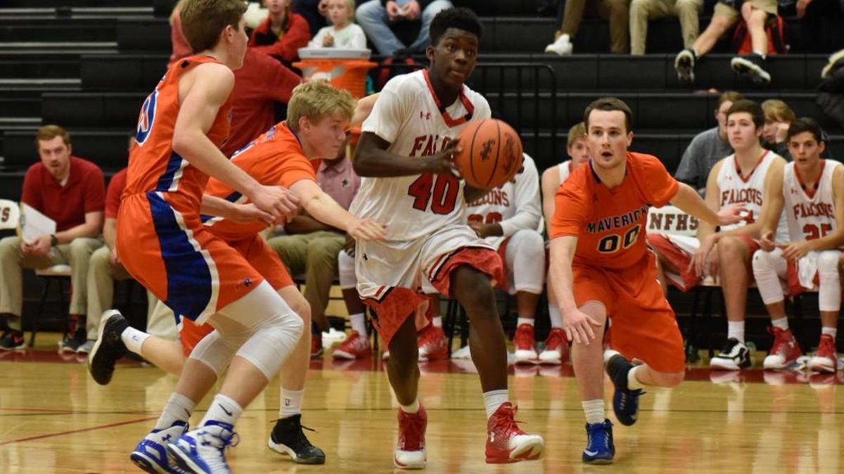 Malik Bryant takes the ball toward the net Friday night for Nation Ford. The Falcons lost to Marvin Ridge for the second time this season.