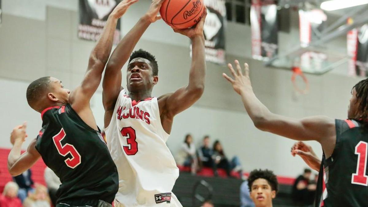 Nation Ford's Khydarius Smith (3) powers to the basket against Boiling Springs #Pierre Gentry.