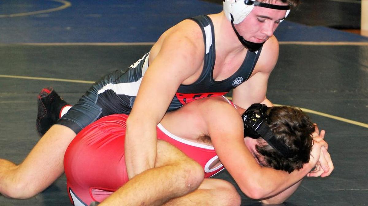 Nation Ford’s Dylan Curtsinger wrestles an opponent from Lander during the first round of the R-S Central Duals.