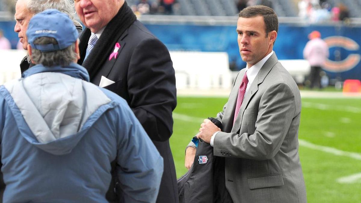 Carolina Panthers Assistant General Manager Brandon Beane, right, looks on as team owner Jerry Richardson talks with guests along the team’s sideline at Soldier Field in Chicago in 2012. Beane, who was serving as interim GM at the time, is a Fort Mill resident.