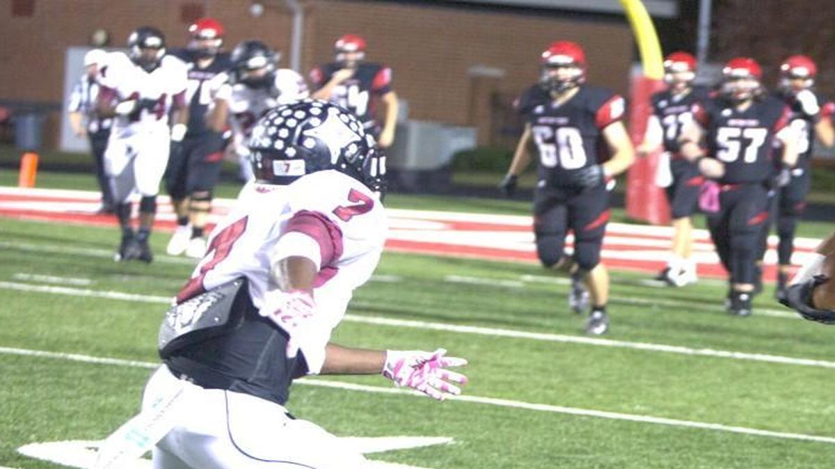 Wide receiver Josh Shave (5) tries to elude Rock Hill’s Kentrell Mccrorey during the Falcons win against the Bearcats Friday.