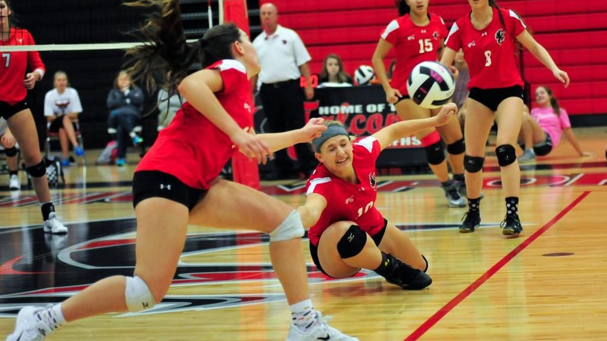 Emily Lammers, left, and Carli Pigza, center, make a play against Mauldin Thursday night. Mauldin defeated Nation Ford 3-1 in Thursday night's playoff match at Nation Ford to advance to the Upper State match.