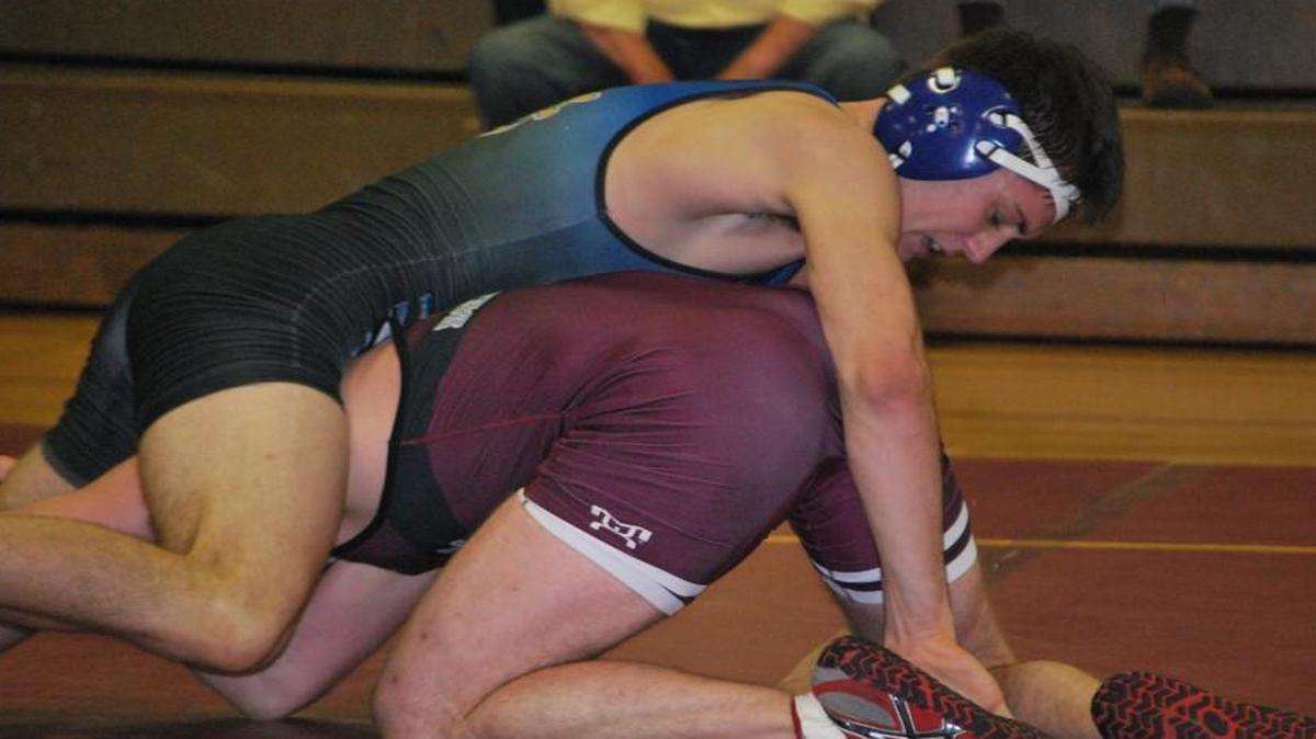 Fort Mill’s Jack Debbout, who picked up his 100 th career win earlier in the week, wrestles Rock Hill’s Noah Reynolds. Debbout won by major decision