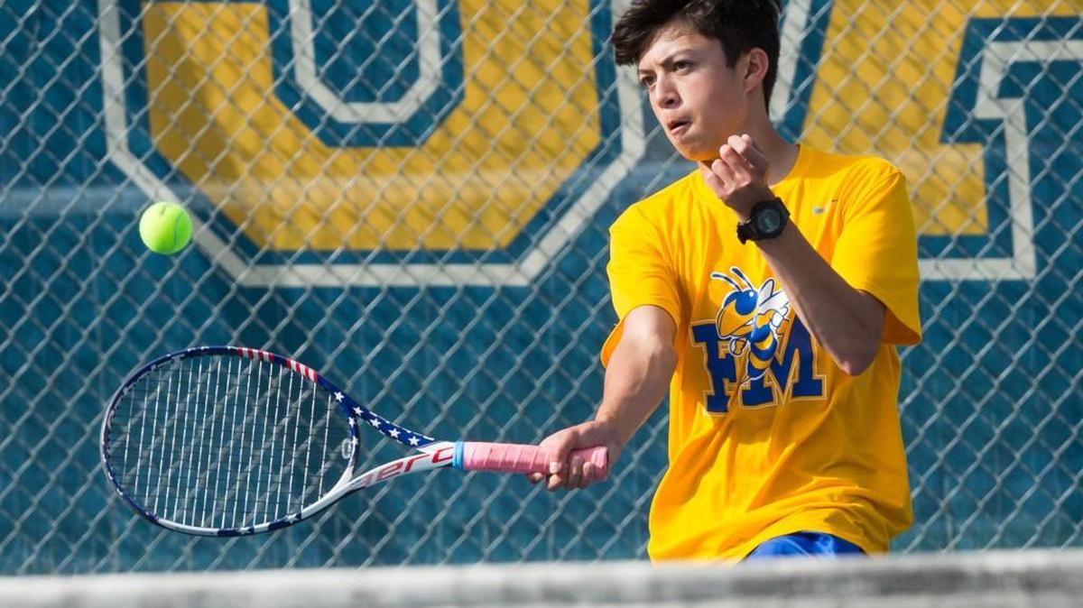 Fort Mill's Matt Sanford connects for the point on his way to a 6-1, 6-1 victory over Northwestern. It was their last win before an early exit in the playoffs.