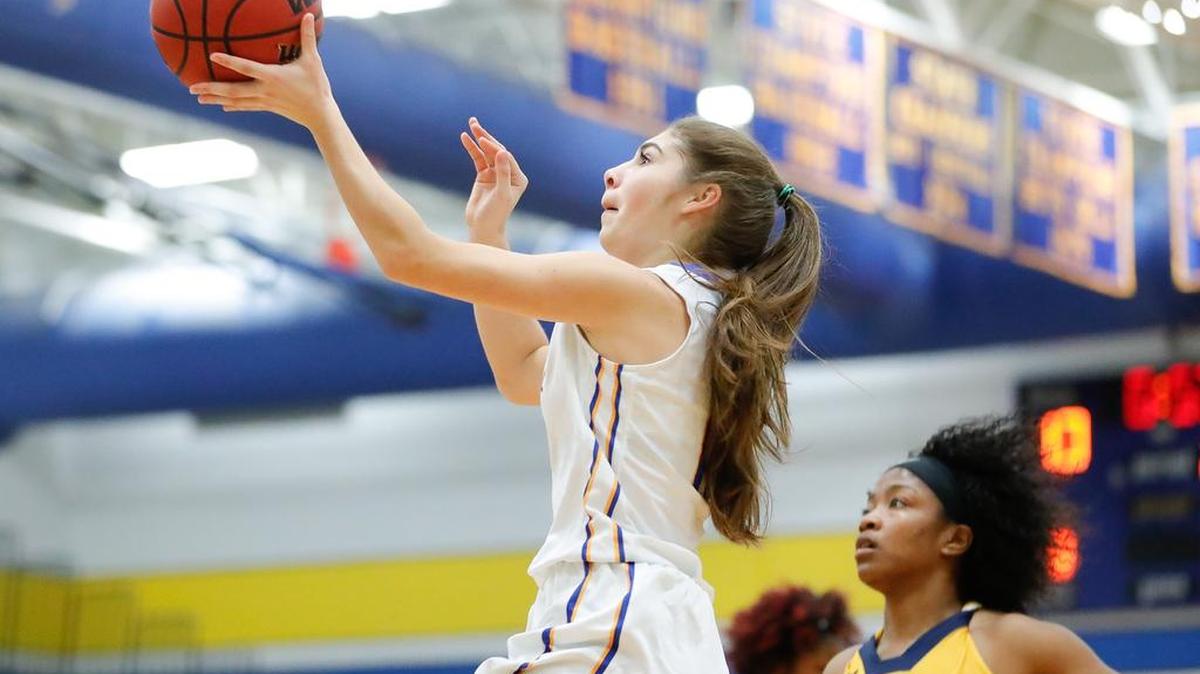 Fort Mill's Wallace Cortazar drives in for the layup as Fort Mill hosted Lancaster in non conference game.