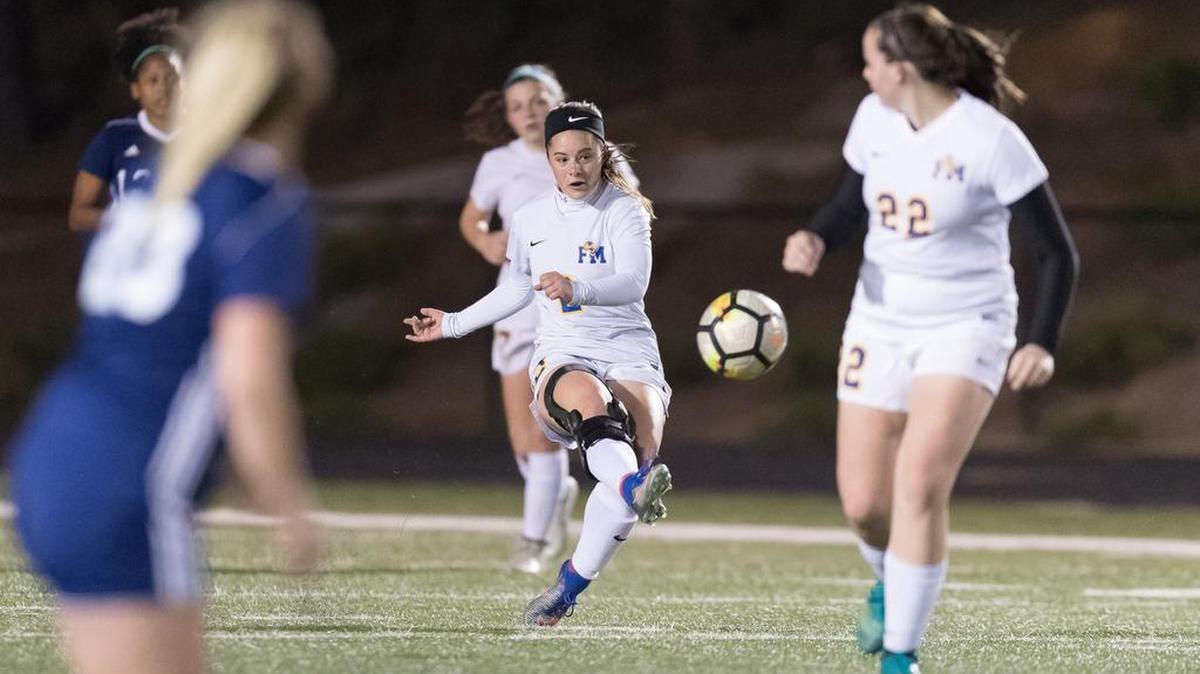 Fort Mill's Ashlyn Stanley advances the ball down field as the Fort Mill Yellow Jackets hosts the No. 1-ranked Clover Blue Eagles in girls varsity soccer Friday. Fort Mill pulled off the upset on penalty kicks.