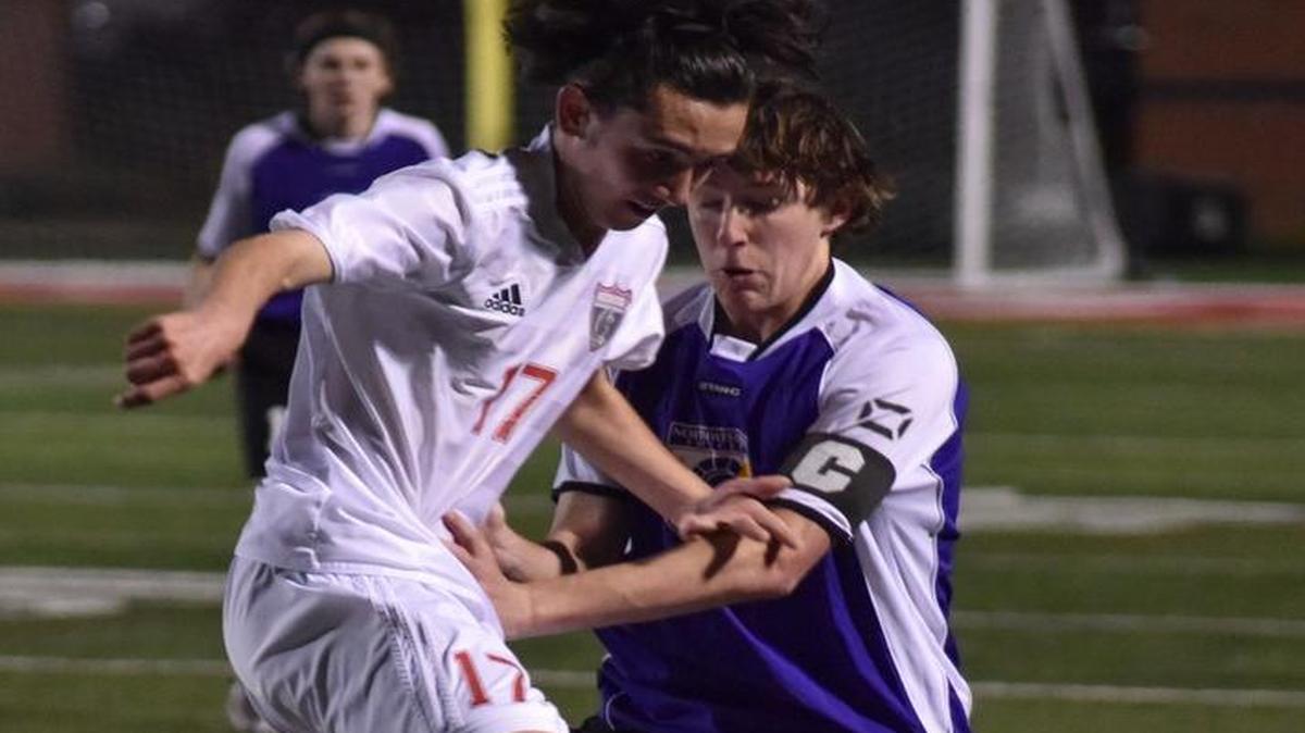 Nation Ford sophomore Steen Halas, left, keeps the ball from Northwestern senior Cody Teal last week at Nation Ford.