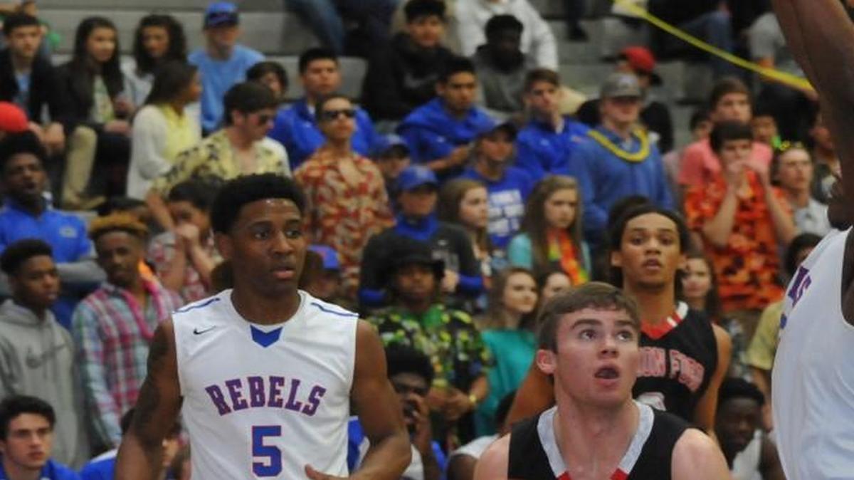 Nation Ford’s Will Lawhon looks for opening while defended by a Byrnes player during the Falcons’ playoff loss Saturday.