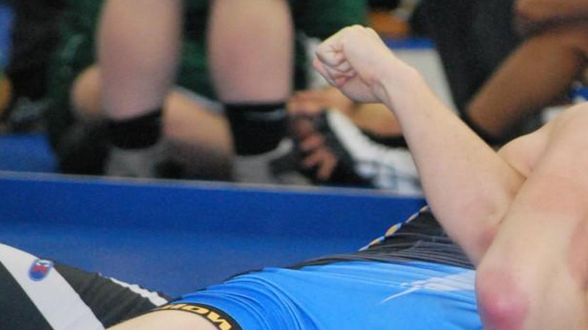 Fort Mill’s Evan Stankovits gets a takedown and goes for the pin during a 160-pound match in the Wildcat Duals.