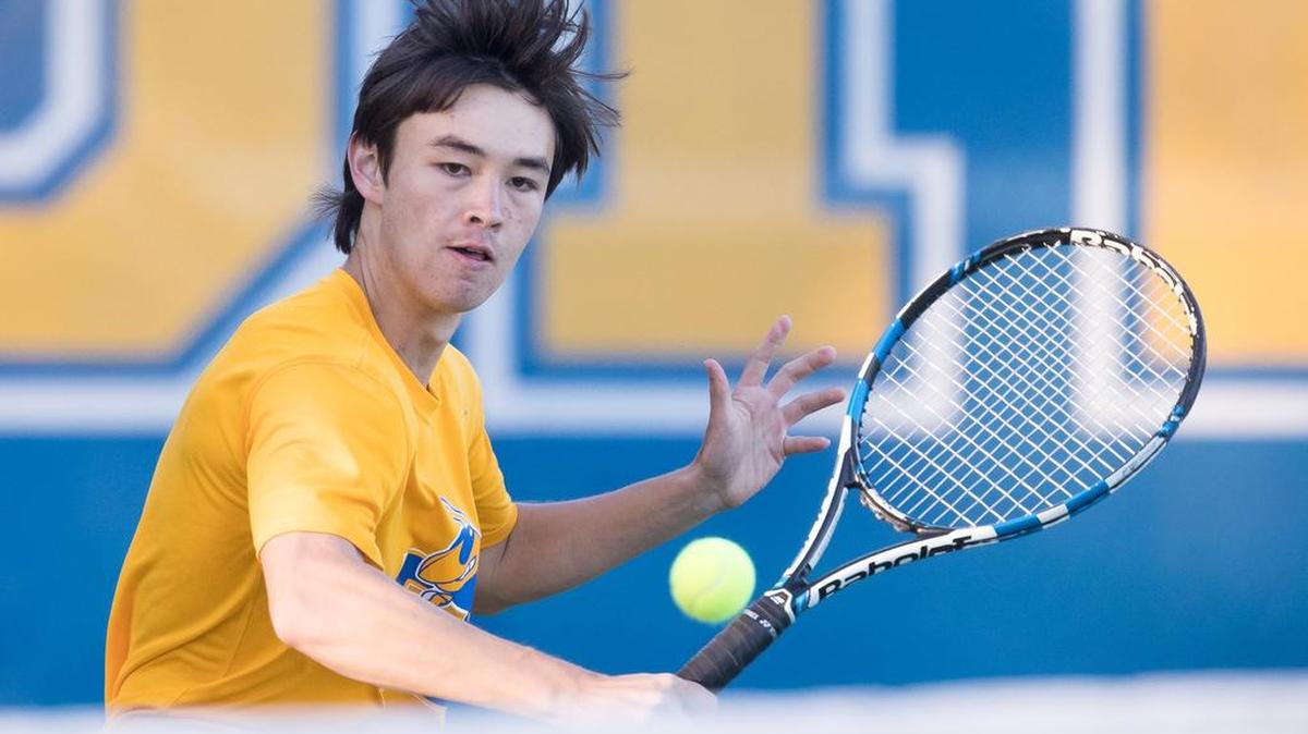 Fort Mill’s Josh Hall charges the net against a Lancaster opponent last week in tennis.