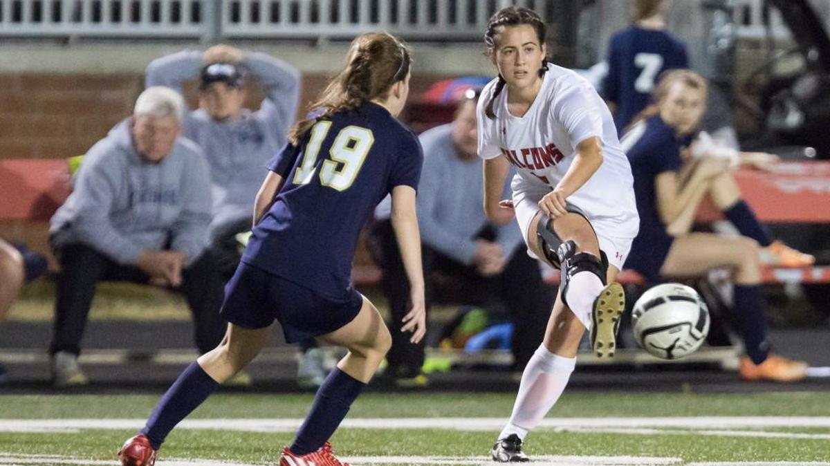 Nation Ford's Chloe Emerson (16) makes a pass during a win over Spartanburg in the NaFo girls’ soccer home opener.