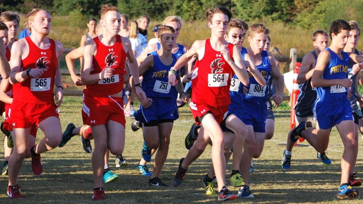 Members of the Nation Ford and Fort Mill boys’ cross country team take off at the start of the Region IV-5A cross-country meet.