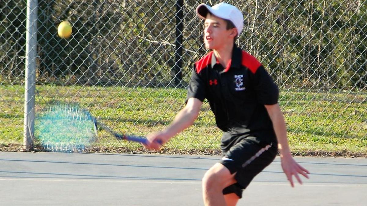 Nation Ford’s Ian Drane returns the ball during his match against Rock Hill.