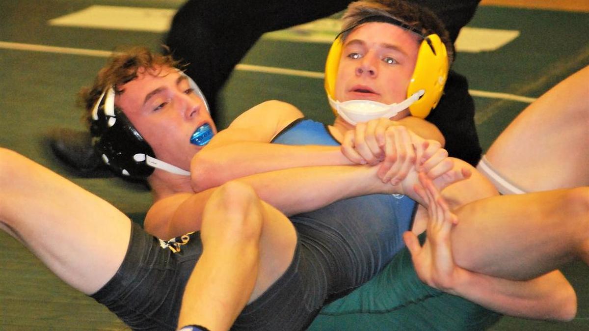 Fort Mill’s Brody Claassen (top) works to lock up an opponent from Dutch Fork in the Jackets’ opening wrestling meet of the season.