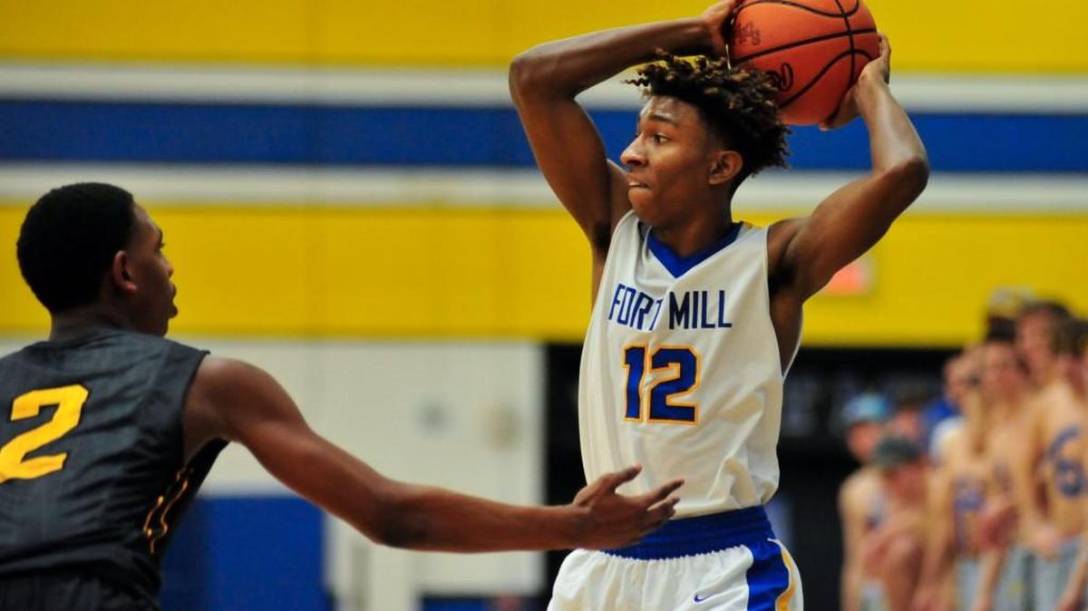 Greenwood's Donovan Williams guards Fort Mill junior William Ross (12) Wednesday night at Fort Mill. Greenwood won the playoff game 51-50.