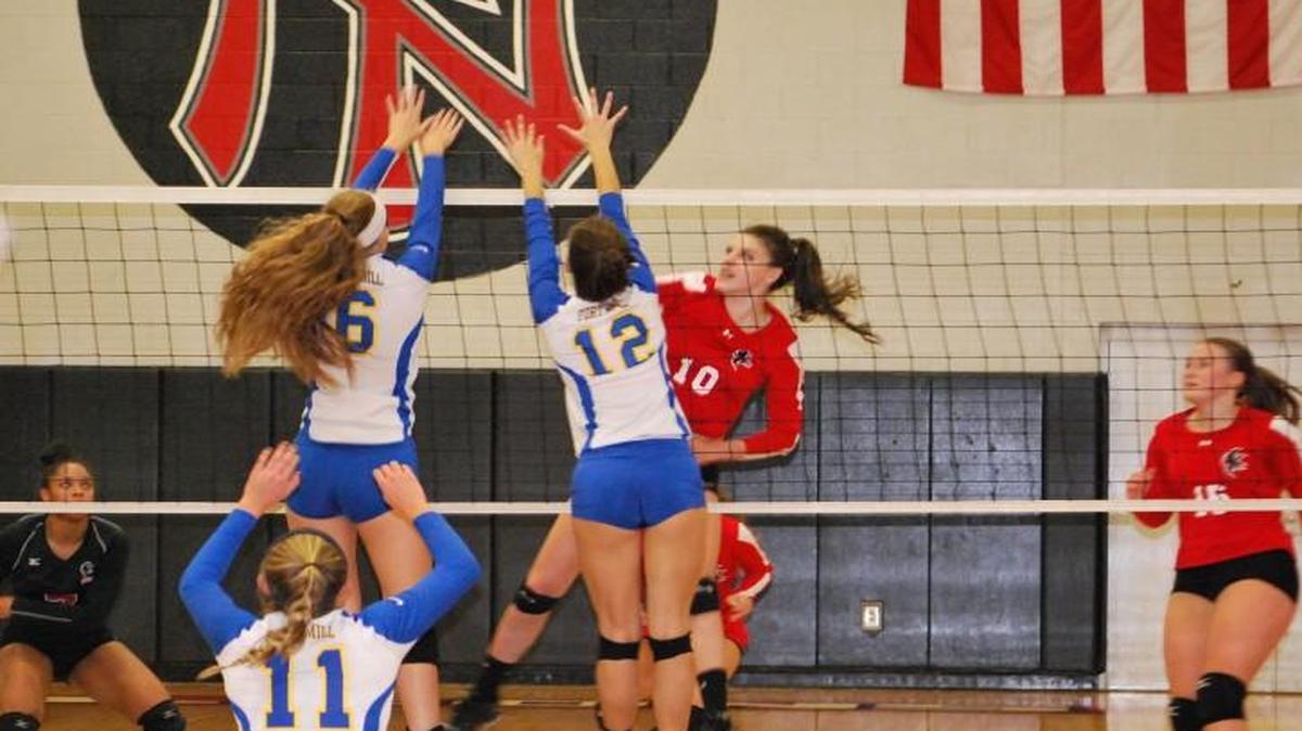 
Nation Ford’s Quin Sutphin (10) knocks the ball by two Fort Mill defenders.
