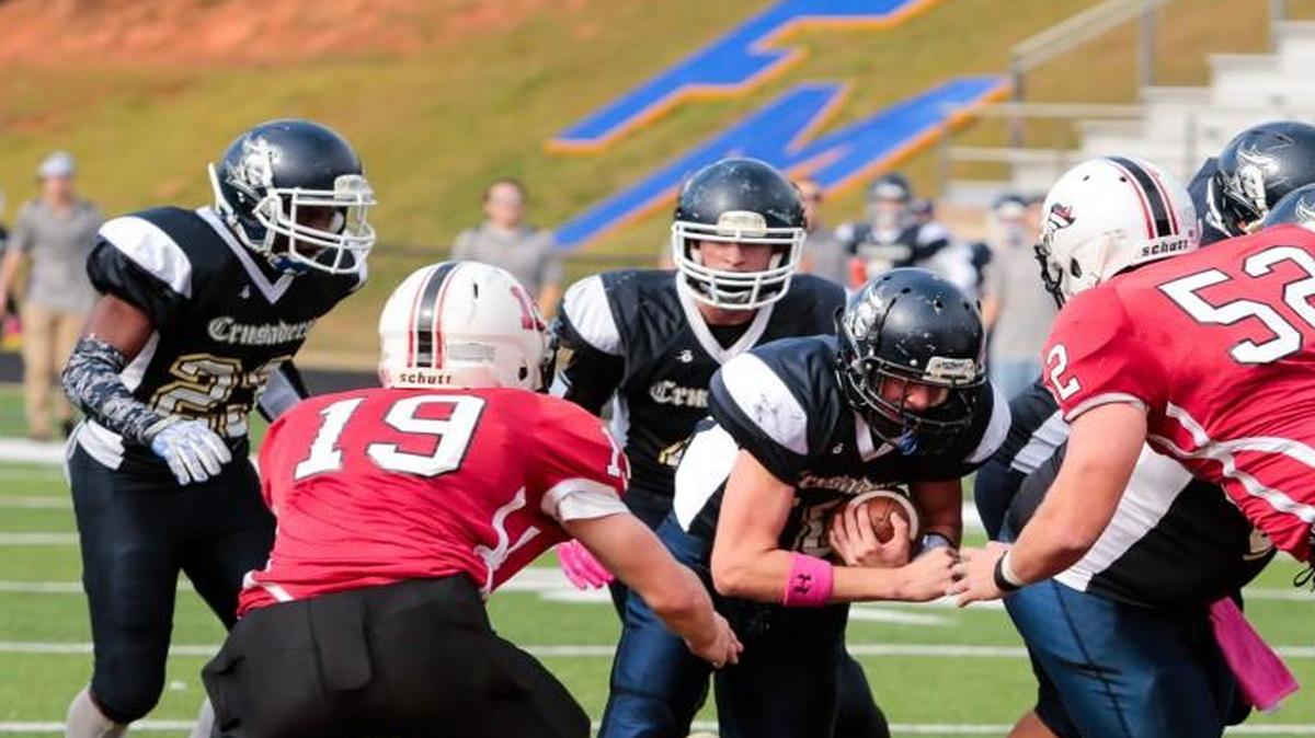 The Crusaders’ Dalton Moon (10), of Fort Mill, powers toward the goal line in the Pioneer Football League Championship game against the Cabarrus Stallions at Fort Mill High School Saturday.